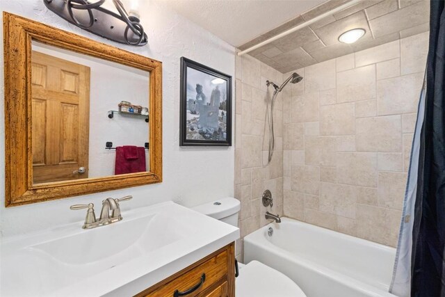 805 Columbine Rd Unit 202, Breckenridge, CO 80424 - bathroom featuring toilet, shower / bath combo with shower curtain, and vanity