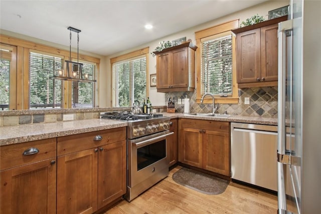 188 Tip Top Trl Unit 6558, Dillon, CO 80435 - kitchen featuring appliances with stainless steel finishes, brown cabinets, and plenty of natural light