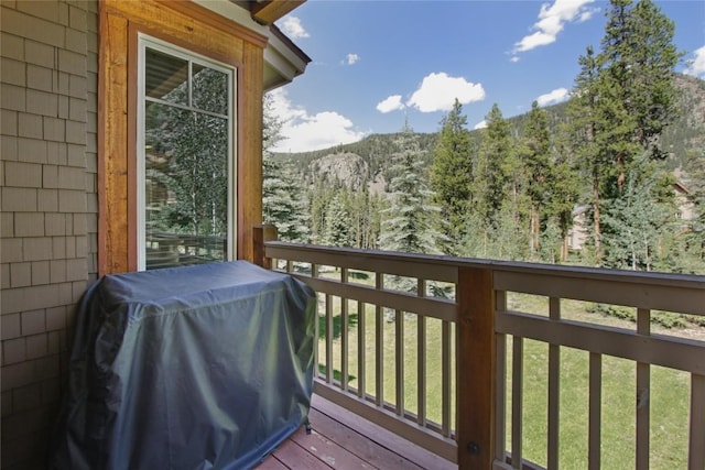 188 Tip Top Trl Unit 6558, Dillon, CO 80435 - balcony featuring grilling area, a wooded view, and a deck with mountain view