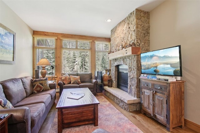 188 Tip Top Trl Unit 6558, Dillon, CO 80435 - living area featuring wood finished floors and a stone fireplace