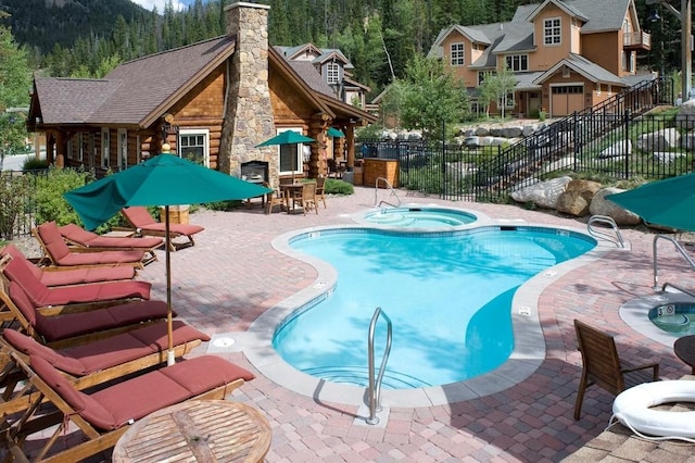 188 Tip Top Trl Unit 6558, Dillon, CO 80435 - community pool with a hot tub, a patio, and a forest view