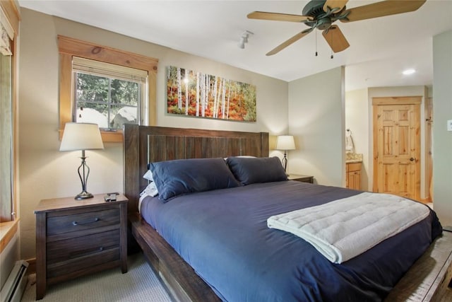 188 Tip Top Trl Unit 6558, Dillon, CO 80435 - bedroom featuring baseboard heating, ensuite bath, and carpet floors