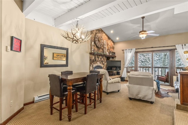 2735 Burgess Creek Rd Unit 11, Steamboat Springs, CO 80487 - carpeted dining room featuring a baseboard heating unit, a stone fireplace, a chandelier, baseboards, and a ceiling fan