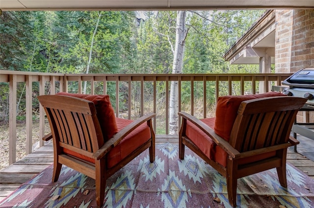 2735 Burgess Creek Rd Unit 11, Steamboat Springs, CO 80487 - wooden terrace featuring a wooded view and grilling area