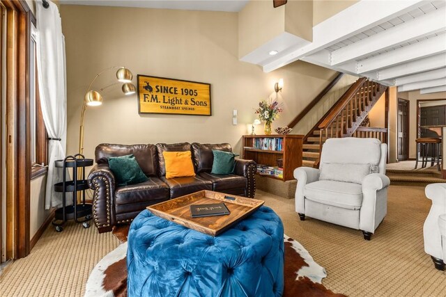 2735 Burgess Creek Rd Unit 11, Steamboat Springs, CO 80487 - living room featuring carpet flooring, stairway, beam ceiling, and baseboards