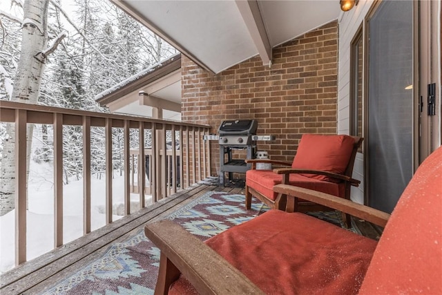 2735 Burgess Creek Rd Unit 11, Steamboat Springs, CO 80487 - snow covered back of property featuring a grill