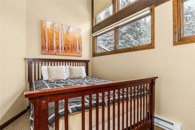 2735 Burgess Creek Rd Unit 11, Steamboat Springs, CO 80487 - carpeted bedroom featuring baseboard heating and baseboards