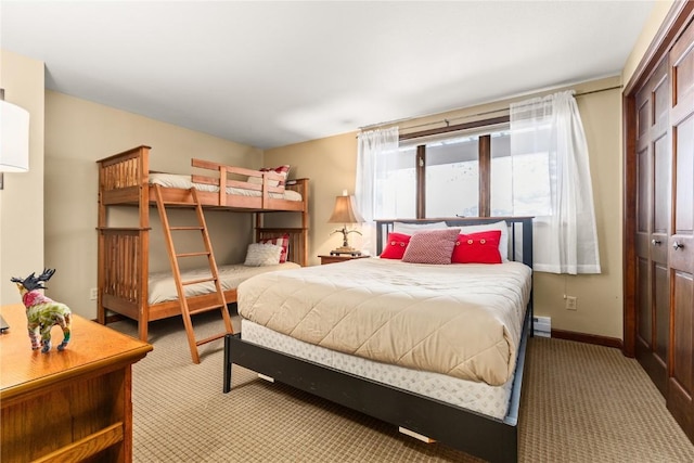 2735 Burgess Creek Rd Unit 11, Steamboat Springs, CO 80487 - bedroom with carpet floors, baseboard heating, and baseboards