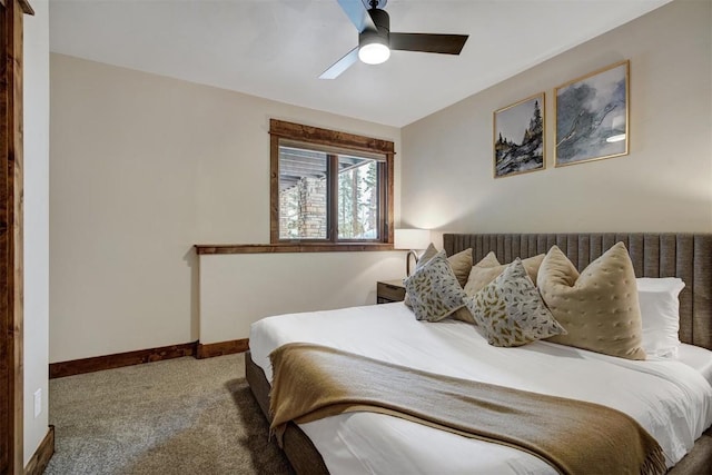 carpeted bedroom with a ceiling fan and baseboards