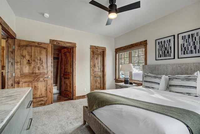 bedroom with a ceiling fan, carpet flooring, and baseboards