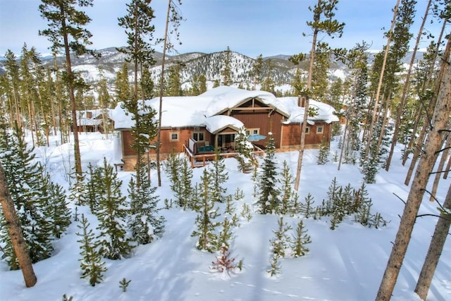 exterior space featuring a garage and a mountain view