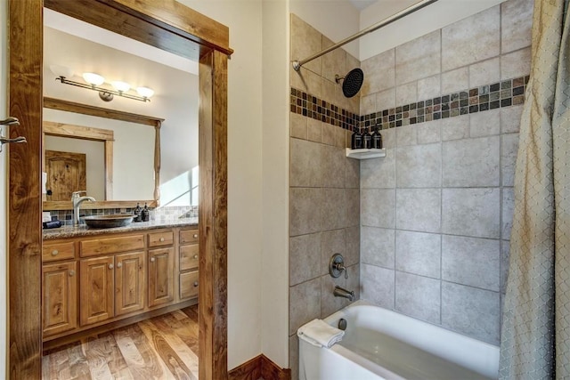 full bath featuring vanity, shower / tub combo with curtain, and wood finished floors