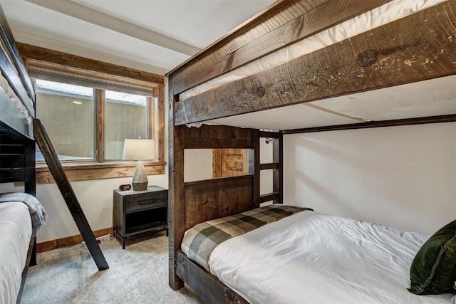 bedroom featuring carpet floors and baseboards