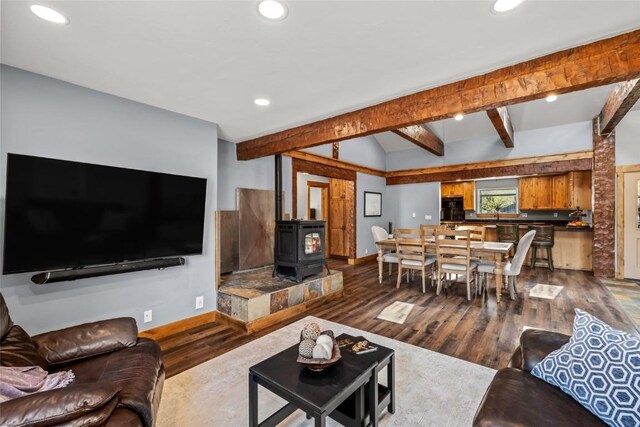 77 Lincoln St, Yampa, CO 80483 - living area featuring dark wood-type flooring, baseboards, recessed lighting, and a wood stove