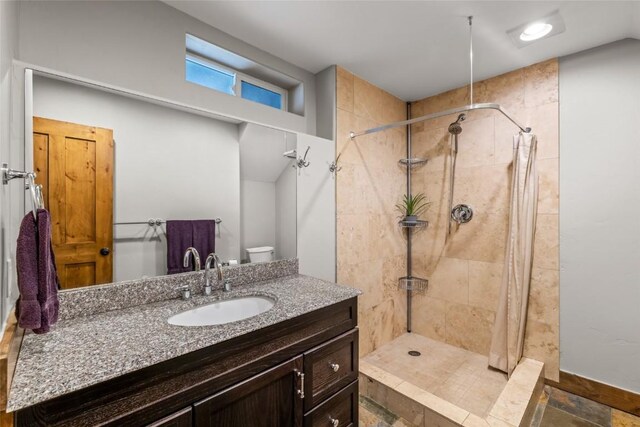 77 Lincoln St, Yampa, CO 80483 - full bathroom featuring a tile shower, vanity, and toilet