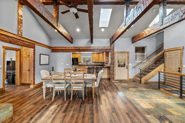 77 Lincoln St, Yampa, CO 80483 - dining area featuring high vaulted ceiling, a ceiling fan, beamed ceiling, baseboards, and a skylight