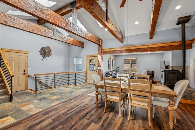 77 Lincoln St, Yampa, CO 80483 - dining space featuring beam ceiling, a wood stove, wood finished floors, recessed lighting, and high vaulted ceiling