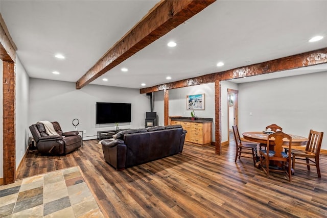77 Lincoln St, Yampa, CO 80483 - living area with a wood stove, recessed lighting, dark wood finished floors, baseboards, and a baseboard heating unit