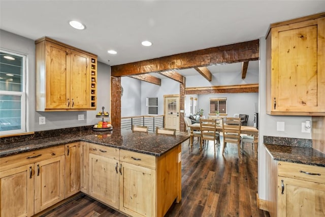 77 Lincoln St, Yampa, CO 80483 - kitchen featuring a peninsula, beam ceiling, dark wood finished floors, dark stone countertops, and light brown cabinetry