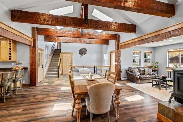 77 Lincoln St, Yampa, CO 80483 - dining area with a baseboard radiator, stairs, dark wood-type flooring, and a skylight