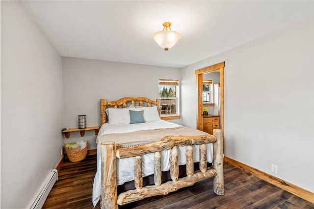77 Lincoln St, Yampa, CO 80483 - bedroom with a baseboard heating unit, baseboards, and wood finished floors