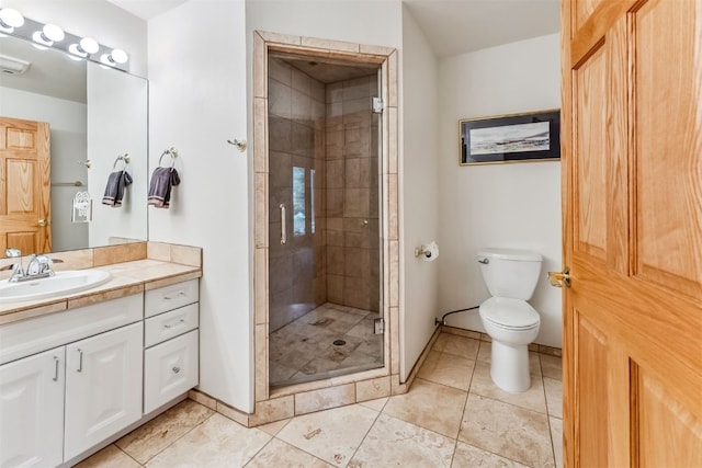 1118 Penstemon Rd, Dillon, CO 80435 - bathroom with vanity, toilet, a shower stall, tile patterned flooring, and baseboards