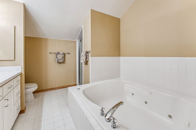 1118 Penstemon Rd, Dillon, CO 80435 - bathroom featuring vanity, toilet, a whirlpool tub, and tile patterned flooring