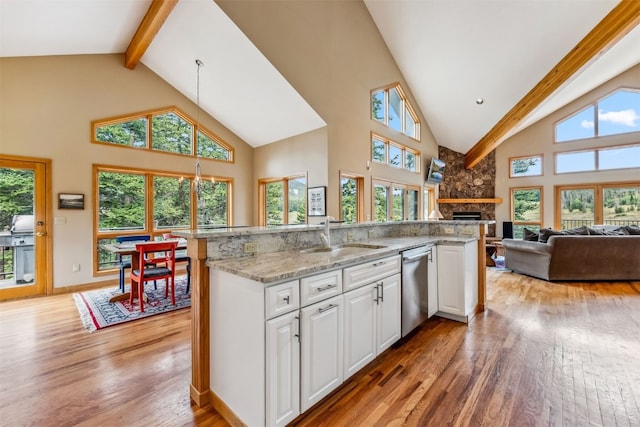 1118 Penstemon Rd, Dillon, CO 80435 - kitchen featuring a sink, dishwasher, high vaulted ceiling, beam ceiling, and light wood finished floors