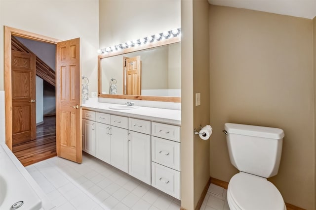 1118 Penstemon Rd, Dillon, CO 80435 - full bath with toilet, vanity, baseboards, tile patterned flooring, and a tub to relax in
