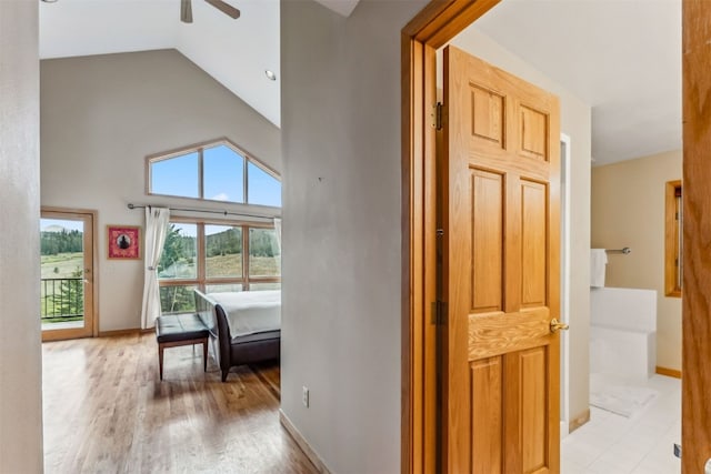 1118 Penstemon Rd, Dillon, CO 80435 - corridor with high vaulted ceiling, light wood-type flooring, and baseboards