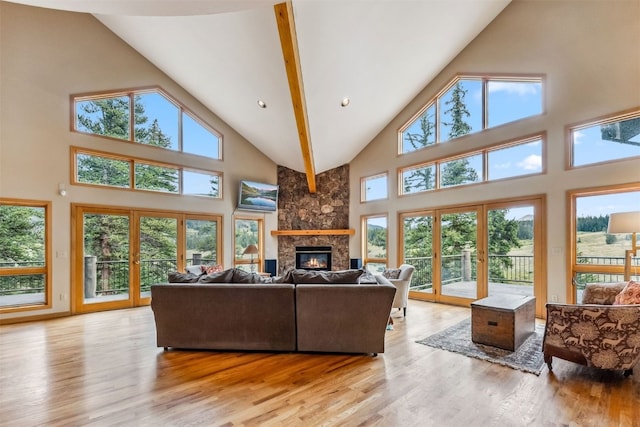 1118 Penstemon Rd, Dillon, CO 80435 - living area featuring high vaulted ceiling, light wood-style flooring, and a large fireplace