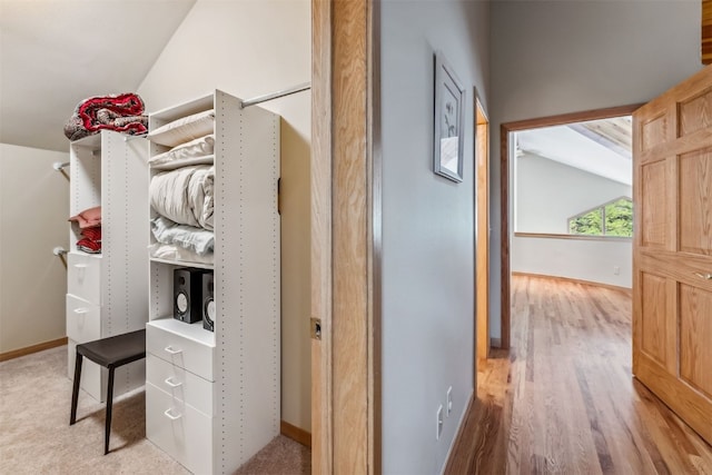 1118 Penstemon Rd, Dillon, CO 80435 - hall with vaulted ceiling, baseboards, and wood finished floors