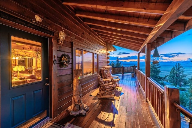 664 Tonkawa Rd, Hartsel, CO 80449 - deck at dusk featuring a water view