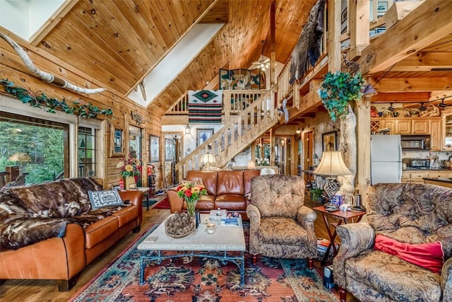 664 Tonkawa Rd, Hartsel, CO 80449 - living room with stairway, a wooden ceiling with exposed beams, high vaulted ceiling, and wood finished floors