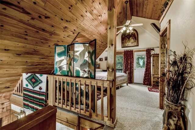 664 Tonkawa Rd, Hartsel, CO 80449 - bedroom featuring wooden ceiling, lofted ceiling, access to exterior, carpet flooring, and wooden walls