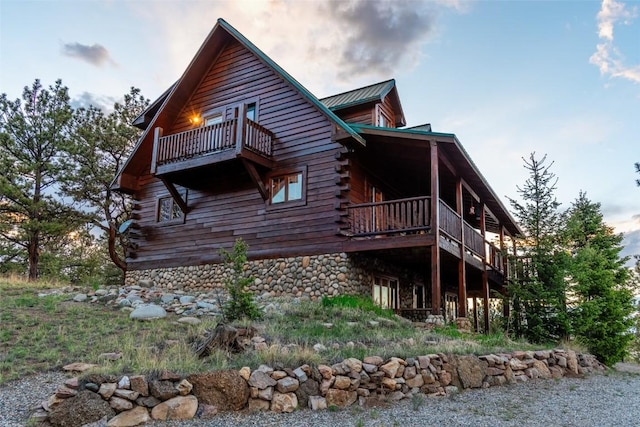 664 Tonkawa Rd, Hartsel, CO 80449 - view of side of home with log exterior and a balcony