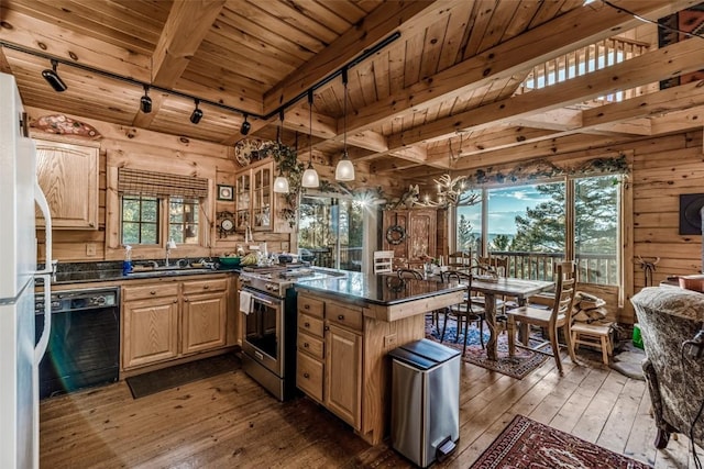 664 Tonkawa Rd, Hartsel, CO 80449 - kitchen with gas range, dishwasher, dark countertops, a wood ceiling with exposed beams, and freestanding refrigerator