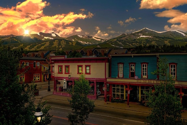 back house at dusk featuring a mountain view