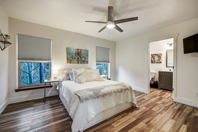 7 Lookout Ridge Dr Unit 7, Dillon, CO 80435 - bedroom with wood finished floors, baseboards, a ceiling fan, and connected bathroom