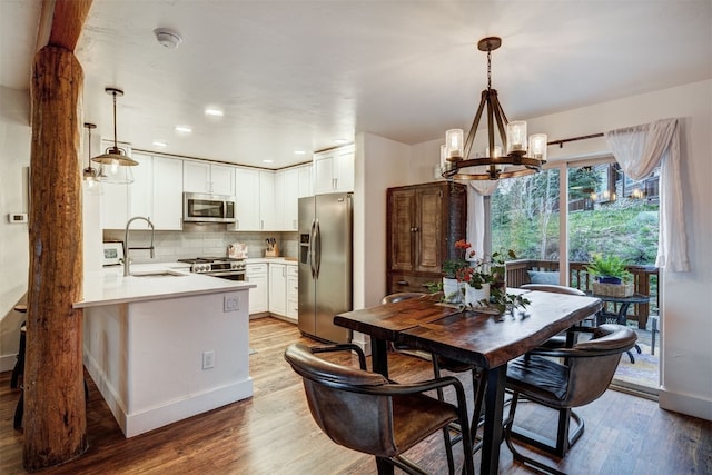 7 Lookout Ridge Dr Unit 7, Dillon, CO 80435 - dining space featuring a chandelier, light wood-style floors, baseboards, and recessed lighting