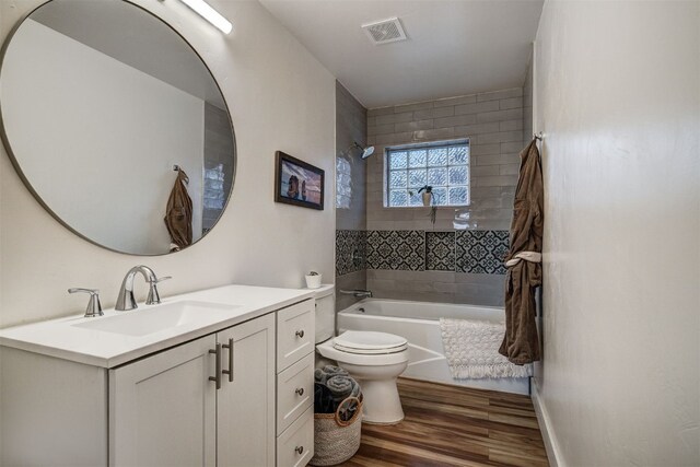 7 Lookout Ridge Dr Unit 7, Dillon, CO 80435 - full bathroom featuring toilet, wood finished floors, vanity, and bathtub / shower combination