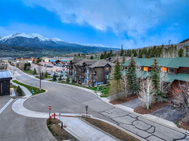 7 Lookout Ridge Dr Unit 7, Dillon, CO 80435 - view of asphalt road with sidewalks, a mountain view, and traffic signs