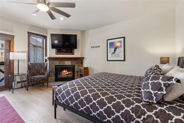 505A S Main St Unit 1204, Breckenridge, CO 80424 - bedroom featuring recessed lighting, ceiling fan, wood finished floors, and a fireplace