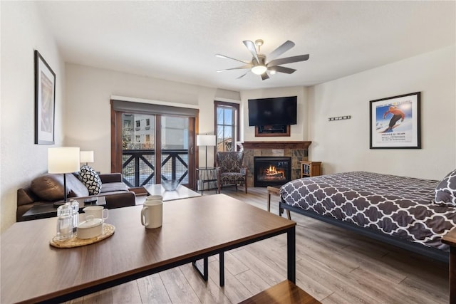 505A S Main St Unit 1204, Breckenridge, CO 80424 - bedroom with a glass covered fireplace and wood finished floors