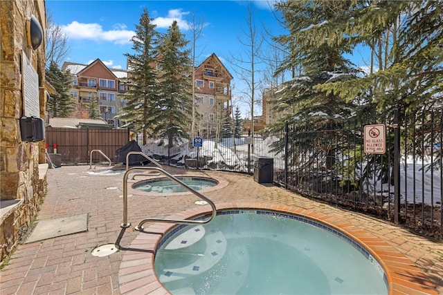 505A S Main St Unit 1204, Breckenridge, CO 80424 - view of swimming pool featuring fence, a patio, and a community hot tub