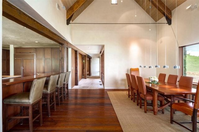 33225 Painted Pony Ln, Steamboat Springs, CO 80487 - dining area with high vaulted ceiling, hardwood / wood-style flooring, a bar, and a wooden ceiling with exposed beams