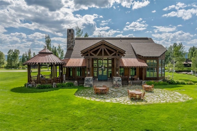 33225 Painted Pony Ln, Steamboat Springs, CO 80487 - back of house with a patio area, a gazebo, a lawn, french doors, and a chimney