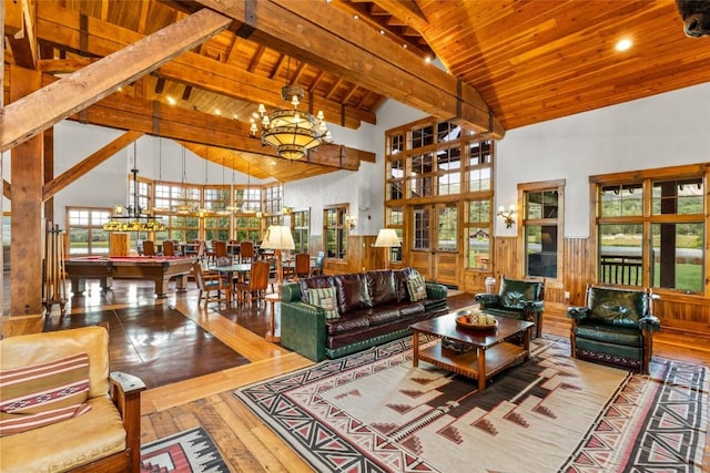 33225 Painted Pony Ln, Steamboat Springs, CO 80487 - living room with a wood ceiling with exposed beams, high vaulted ceiling, billiards table, a chandelier, and hardwood / wood-style flooring