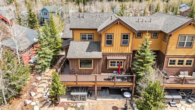200 Rachel Ln, Breckenridge, CO 80424 - back of property featuring board and batten siding, roof with shingles, a patio, and a deck