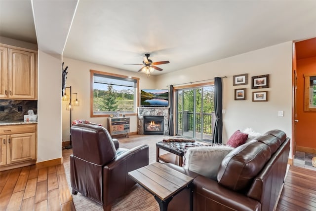 200 Rachel Ln, Breckenridge, CO 80424 - living area featuring ceiling fan, light wood finished floors, a fireplace, and baseboards